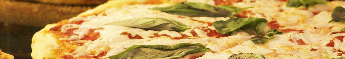 Eating Italian Pizza at Tc Landos Sub Pizzeria restaurant in Leominster, MA.